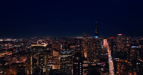 Flying above the immense panorama of luminous New York. Dazzling scenery of the city at night.