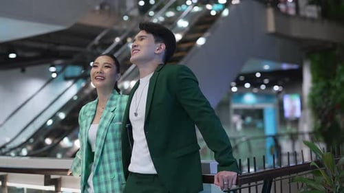 4K Asian couple shopping together at shopping mall on holiday vacation.