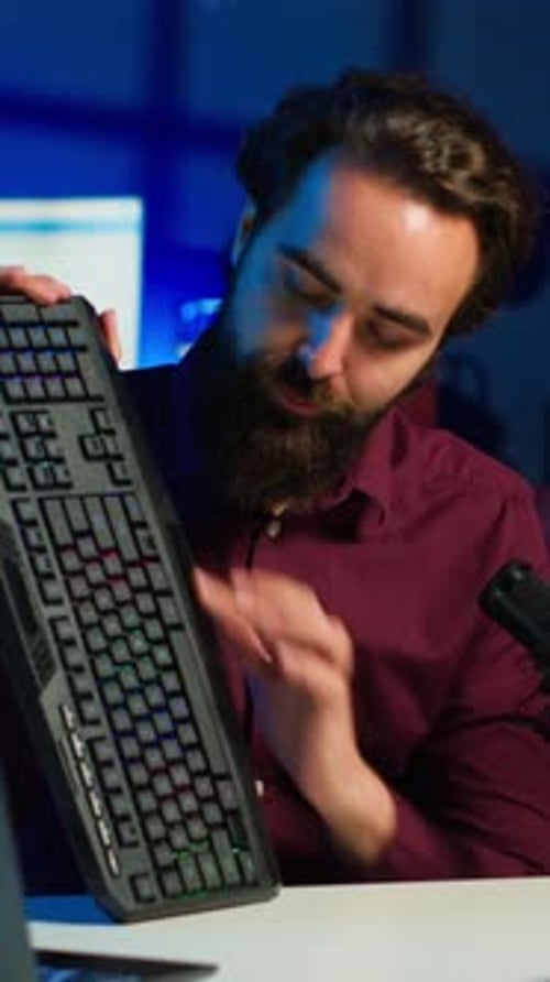 Young Adult Presenting Tech Equipment in Vertical Format