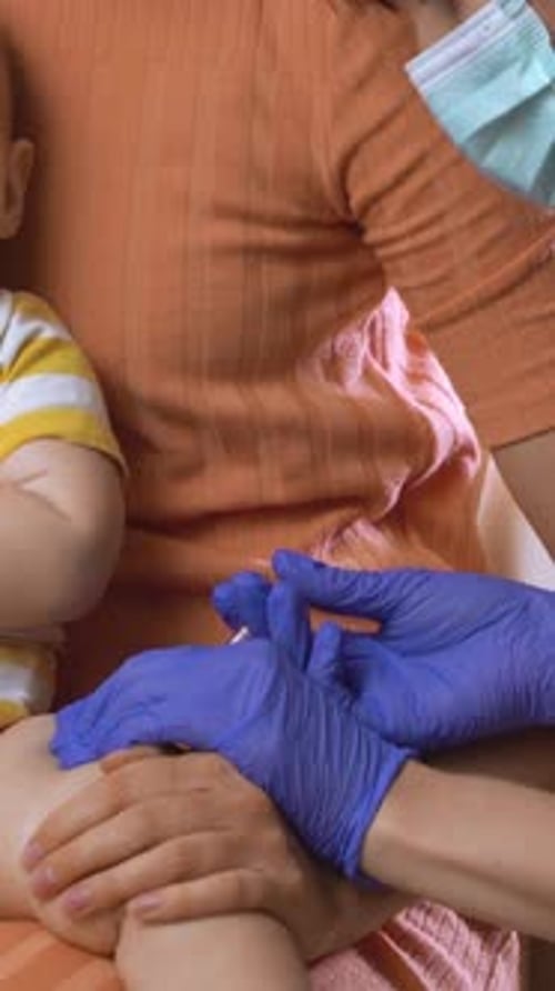 Infant Receives Vaccination at Doctor's Office