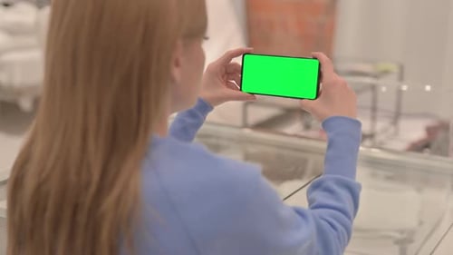 Businesswoman Holding Phone with Chroma Key Screen