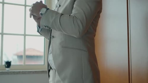 Groom Buttons Jacket Preparing for Special Occasion