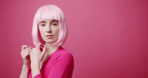 Woman Posing with Pink Wig in Studio