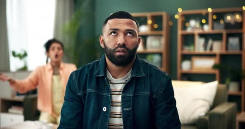 Frustrated Woman Arguing with Unresponsive Man at Home