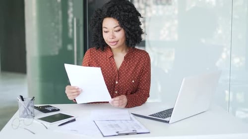 Woman Celebrates Good News at Workplace