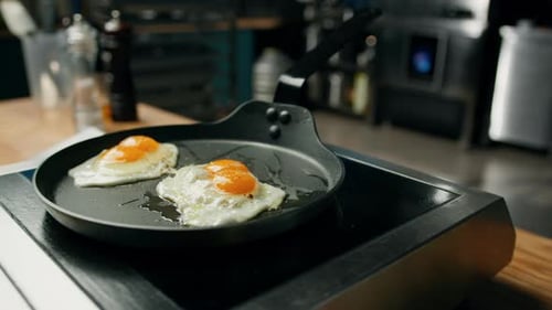 Close Up of Fried Eggs Cooking on Stovetop