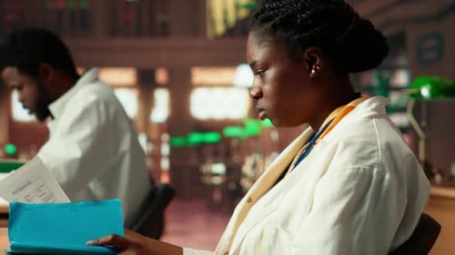 Medical Professional Working in a Library Setting