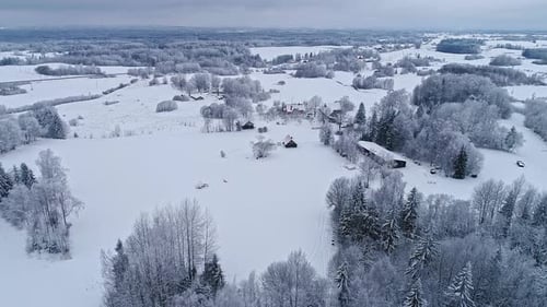Aerial View of Snow-Covered Rural Winter Landscape