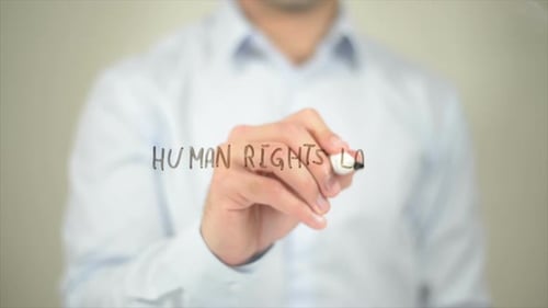 Man Writes Human Rights Law on Transparent Surface