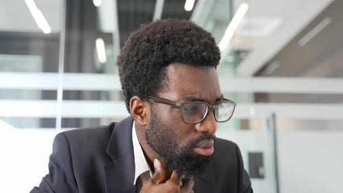 Man with Sore Throat in Office