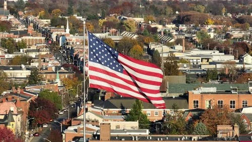 American Flag Waving Proudly in Urban Setting