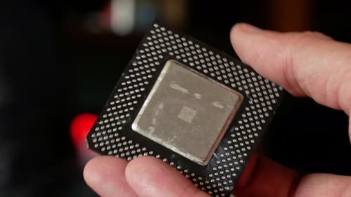 Close-up of a computer microprocessor in hands