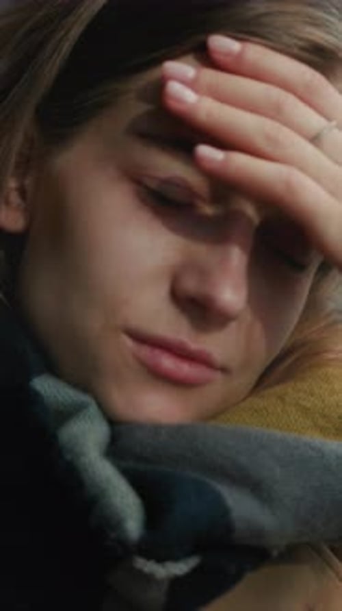 Exhausted Woman Leaning Against Glass Window Woman Appears Tired Resting Against Window During Cold