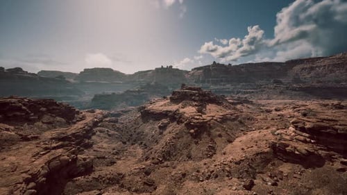 Expansive Rocky Landscape Under a Bright Sky During Midday in a Rugged Terrain