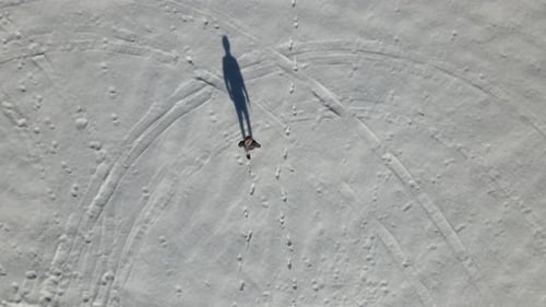 Man Walking On Snow