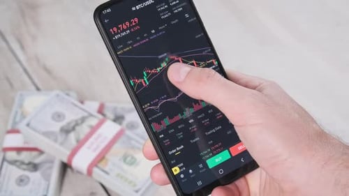 Investor Checking Cryptocurrency Price on Smartphone Screen Bitcoin Price