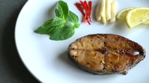 grilled mackerel fish steak on plate