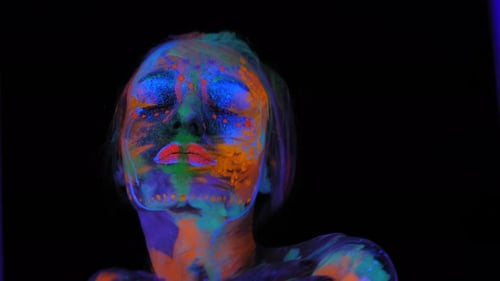 A Girl's Face with an Ultraviolet Pattern in the Light of a Fluorescent Lamp