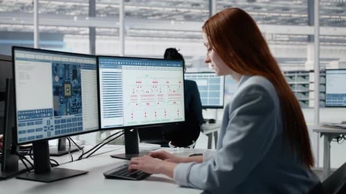 Close Up of Woman in Semiconductors Factory Office Analyzing PCB with Software