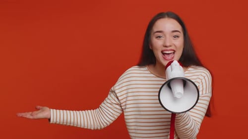 Woman Talking with Megaphone Proclaiming News Loudly Announcing Advertisement Pointing Empty Place