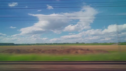 View From the Window of High Speed Train Beautiful Trip with Countryside Scenery Clouds A View of