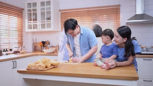 Family Prepares Food Together in Bright Home Kitchen