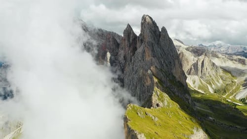 Heavy Clouds Caught on Bare Peak of Seceda Mountain