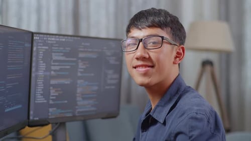 Close Up Of Asian Boy Programmer Smiling To Camera While Creating Software Engineer Developing App