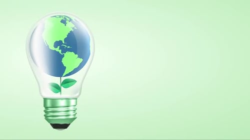 Green Energy Concept Lightbulb with Rotating Earth and Growing Plant