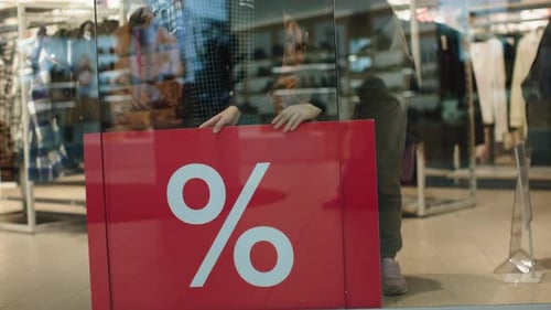 Red Banner Percent Label Sale in Shop Window Discount Sales Clothes Store
