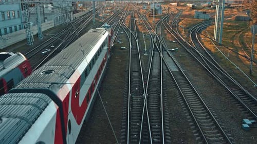Passenger Trains on Railroad Tracks Aerial View