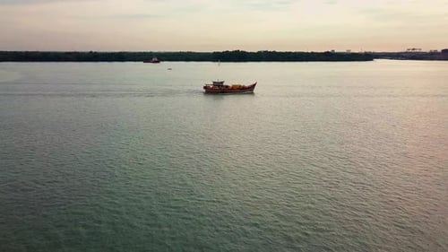 Sunset aerial view of Port Klang and a fishing boat