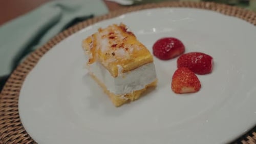 Delicious Cake Dessert Topped with Strawberries on Plate