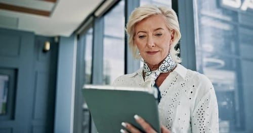 Tablet, research and businesswoman at window in office reading stock market development