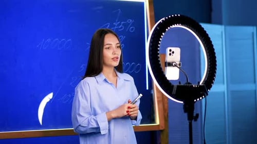 Woman Explains Business Ideas to Online Video Audience