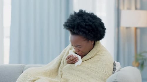 Woman with Cold Coughing and Resting on Couch