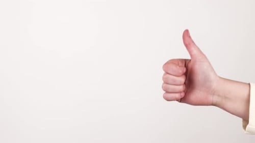 Two types of hand gestures. One thumbs up and one thumbs down.