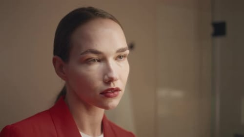Woman in Red Blazer Posing Indoors