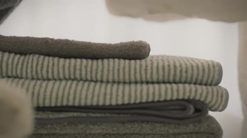 Hand Stacking Folded Towels