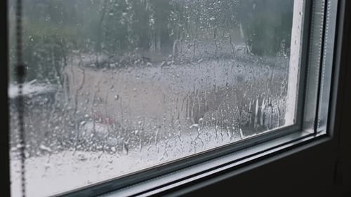 Rainy City Street Through Window