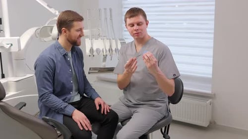 Dentist Explains Dental Procedures to Patient
