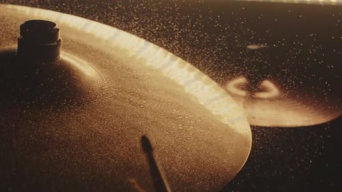 Drumstick Taps Cymbal in Golden Light