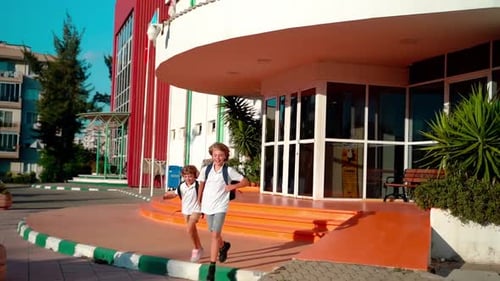 Students Running to Parents After Elementary Primary Middle School Classes or Break Back to School