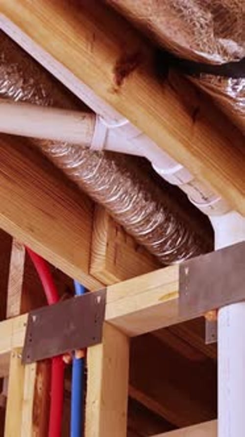 Exposed Piping and Beams of New Home Construction