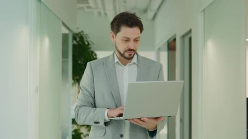 Portrait of Handsome Office Worker Specialist Standing Holding Laptop Computer