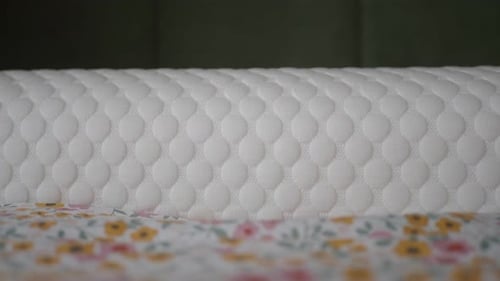 Close Up of Mattress on Floral Pattern Bed