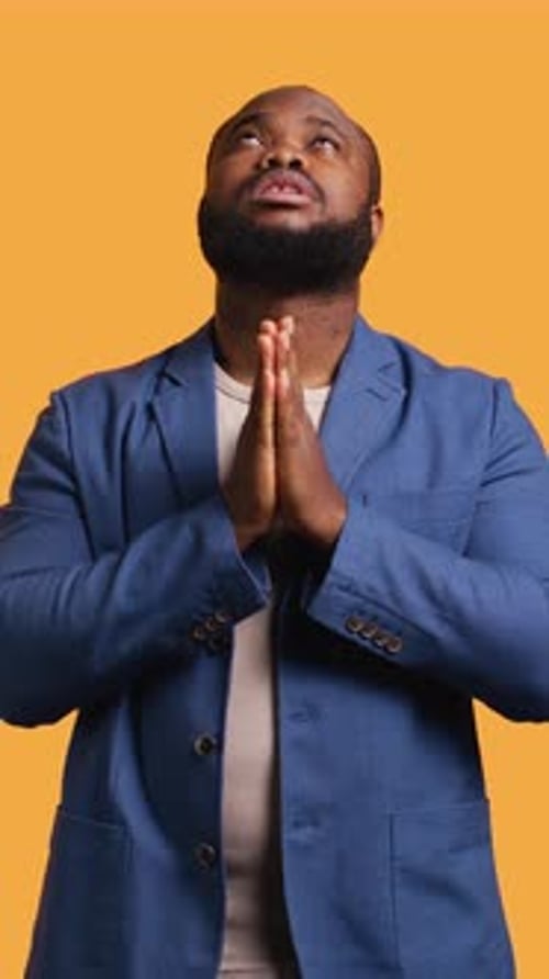 Vertical Video Man Praying to His God Asking for Forgiveness Studio Background