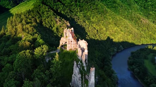 Approaching the ruins of the ancient castle lit by the bright sun.