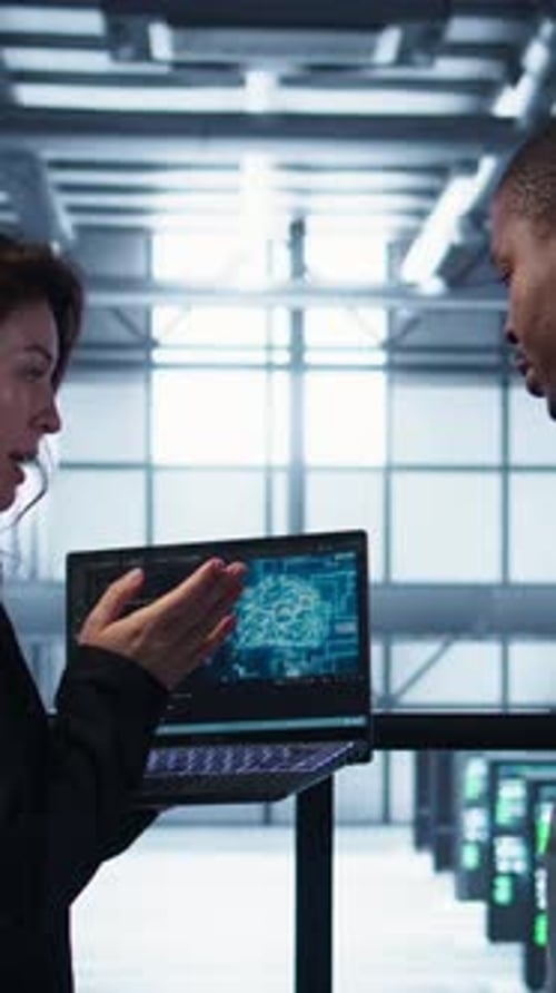 Vertical Video Programmers Coding on Laptop Using Artificial Intelligence in Server Farm