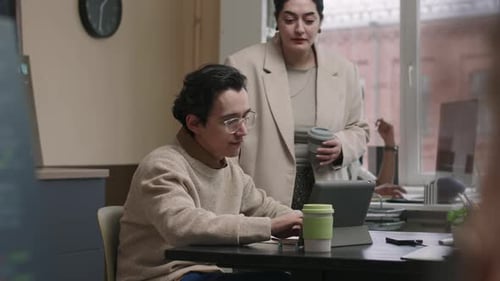 Female Office Leader Talking to System Administrator at Workplace